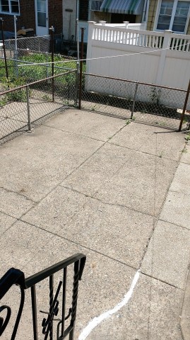 Fenced Rear Yard cement Patio